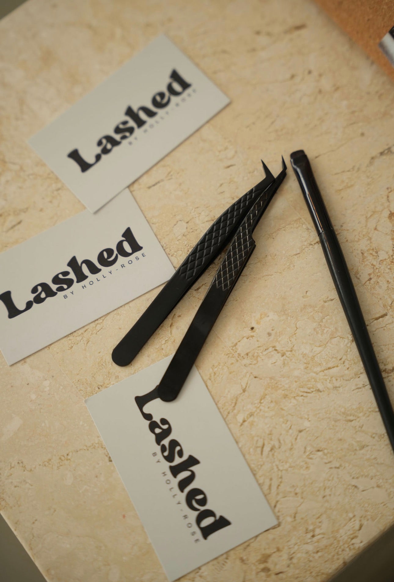 Professional lash tweezers and brush with Lashed by Holly-Rose brand cards